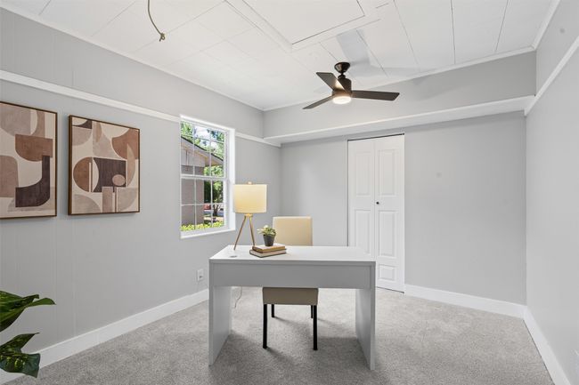 Office area with ceiling fan and carpet flooring | Image 14