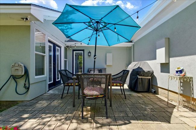 View of patio with outdoor dining space and grilling area | Image 38