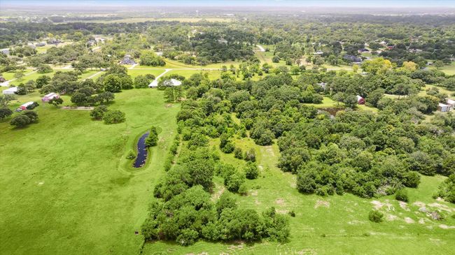 This property currently benefits from an ag exemption — ask for details! With annual taxes around just $10, it's an ideal opportunity to purchase now and build when the timing is right. View from the very back of the lot. | Image 8