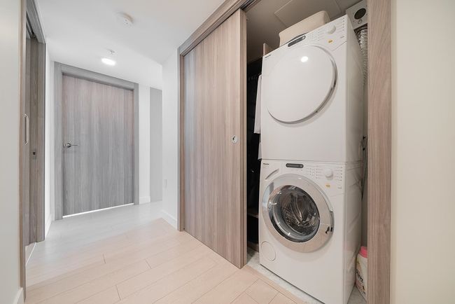 Washroom with stacked washer / dryer | Image 16
