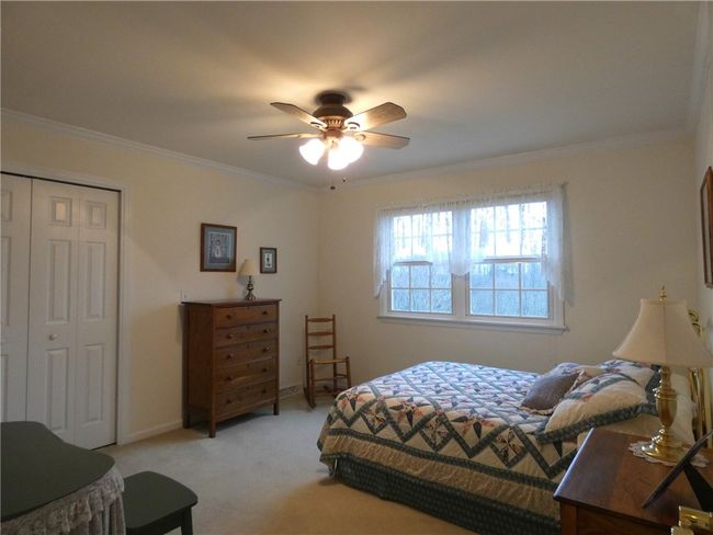 Bedroom 4, cozy and private, is located adjacent to the loft on the upper level | Image 37