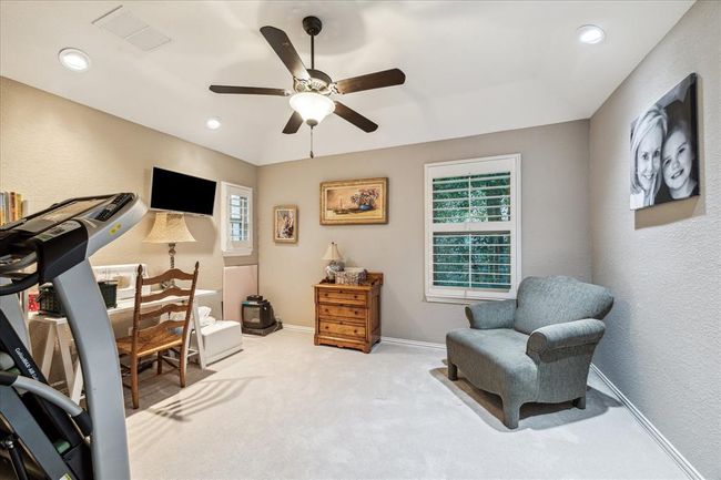 Secondary bedroom located upstairs is currently being used as flex space. | Image 24