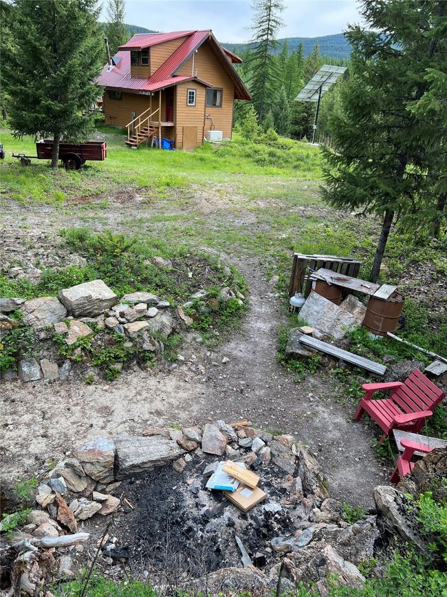 fire pit view with cabin from rock wall above fire pit | Image 77