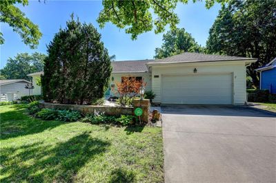 Single story home with a front yard and a garage | Image 1