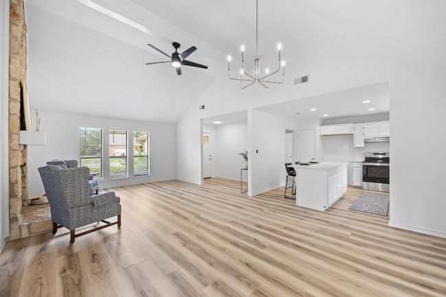 Living area featuring high vaulted ceiling, recessed lighting, and ceiling fan | Image 7