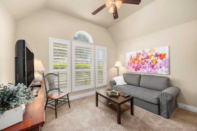 Front bedroom, currently being used as a separate TV room. Features plantation shutters! | Image 22