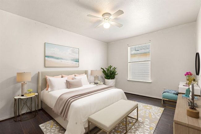 Comfortable secondary bedroom with a large closet and flexible layout, ideal for a home office, nursery, or guest space. Virtually Staged | Image 16
