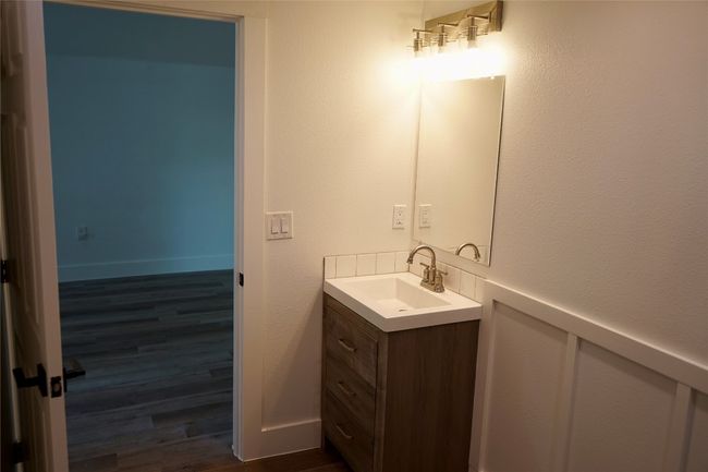 Bathroom featuring vanity and wood finished floors | Image 12
