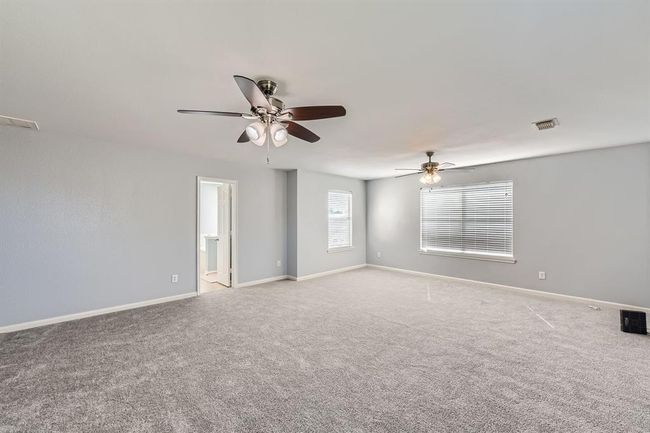 Expansive primary bedroom on the second floor ensures comfort and luxury. | Image 15