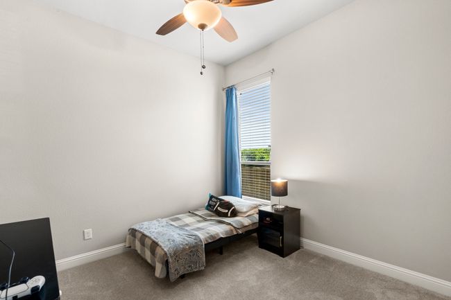 Bedroom featuring carpet floors and a ceiling fan | Image 32