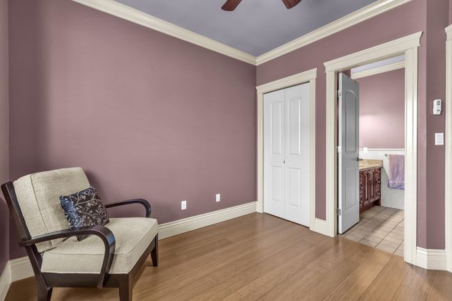 Sitting room featuring wood finished floors, ceiling fan, crown molding, and baseboards | Image 22