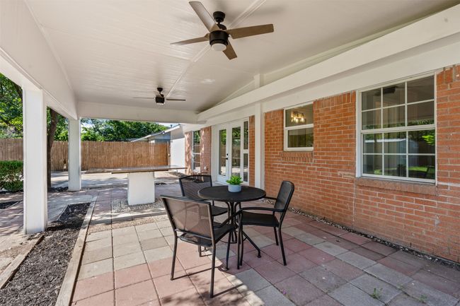 View of patio / terrace featuring french doors, a ceiling fan, and outdoor dining space | Image 27