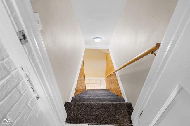 stairway with tile patterned floors | Image 23