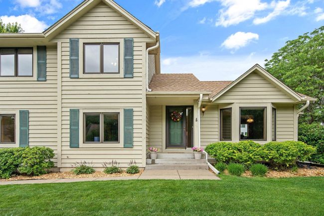 Multiple gathering rooms, three bedrooms and two bathrooms on the upper level await. | Image 6
