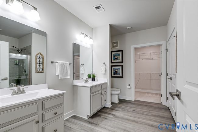Features dual vanities and a spacious walk-in closet | Image 15