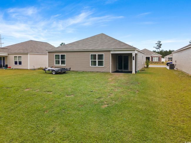 Back of house featuring central AC and a lawn | Image 34