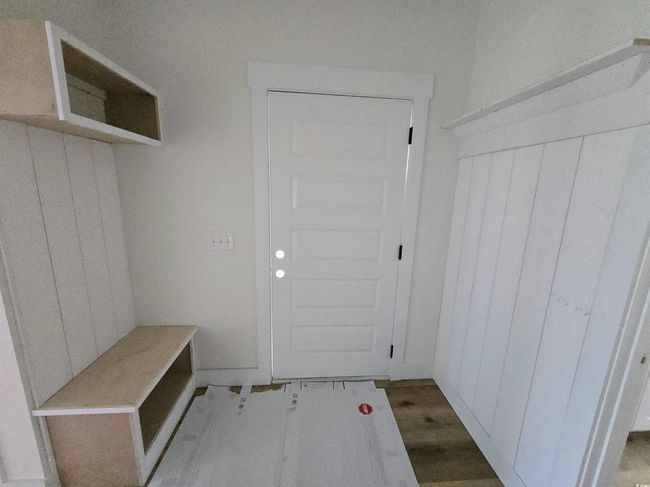 Mudroom featuring wood finished floors | Image 17