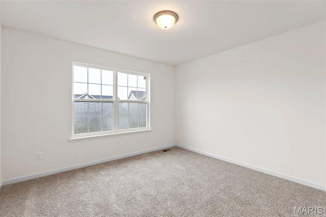 Carpeted spare room featuring baseboards | Image 25