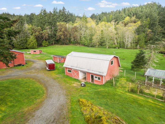 View of subject property featuring a heavily wooded area | Image 46