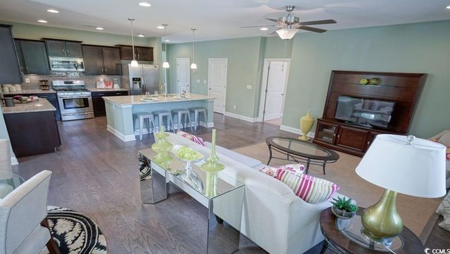 Living area featuring dark wood-style floors, ceiling fan, recessed lighting, and baseboards | Image 17