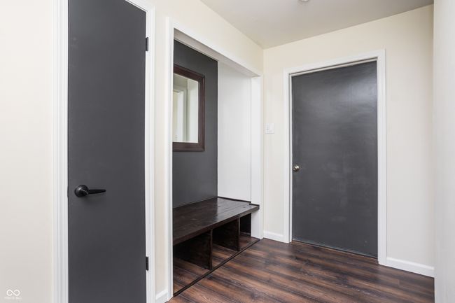 mudroom featuring dark wood-style floors and baseboards | Image 18