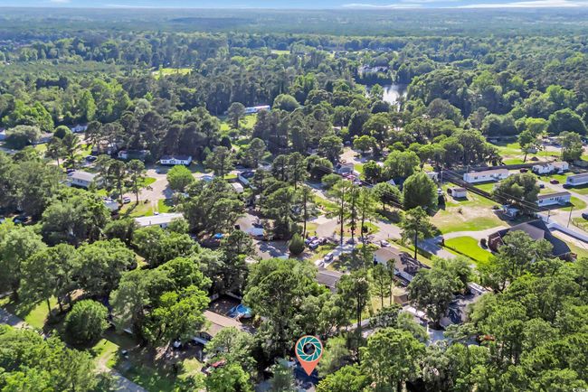 Aerial overview of property's location featuring a heavily wooded area and nearby suburban area | Image 29