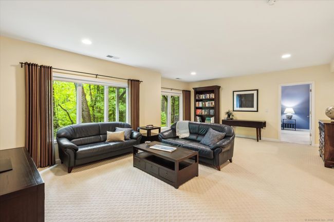 Lower level den with doors that lead to the private patio. | Image 28