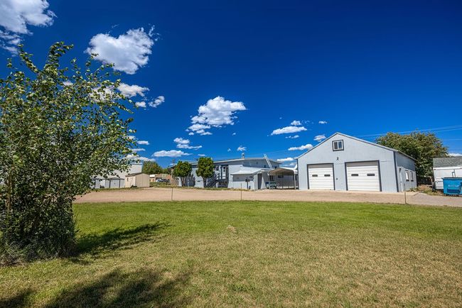 View of yard with an outdoor structure and a garage | Image 25