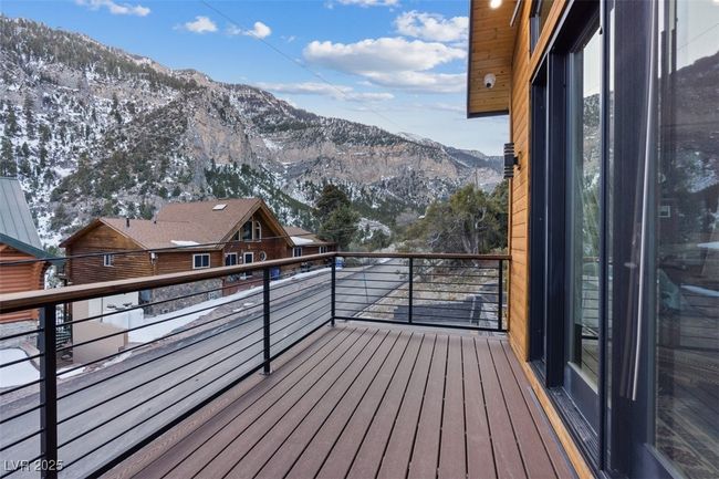 Wooden deck featuring a mountain view | Image 55