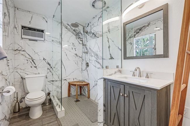 Beautifully appointed Full Bath, gorgeous marble tile, capacious shower, and vanity! | Image 35