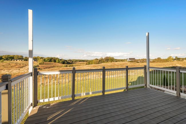 Relax on one of two decks, taking in serene country views. Home overlooks the west offering breathtaking sunsets and ultimate privacy. | Image 31