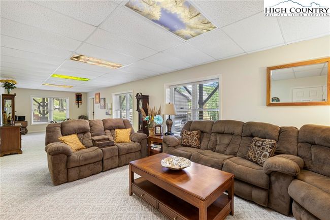living area in basement. So much space! There is also a huge unfinished space used for storage not shown. | Image 40