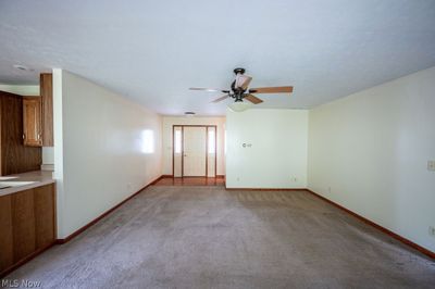 Spare room featuring carpet floors and ceiling fan | Image 2