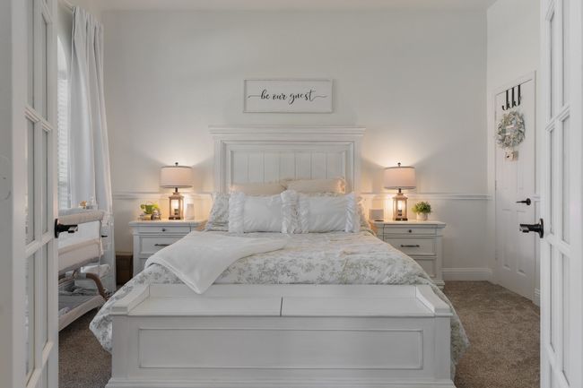 Bedroom with dark carpet and baseboards | Image 7