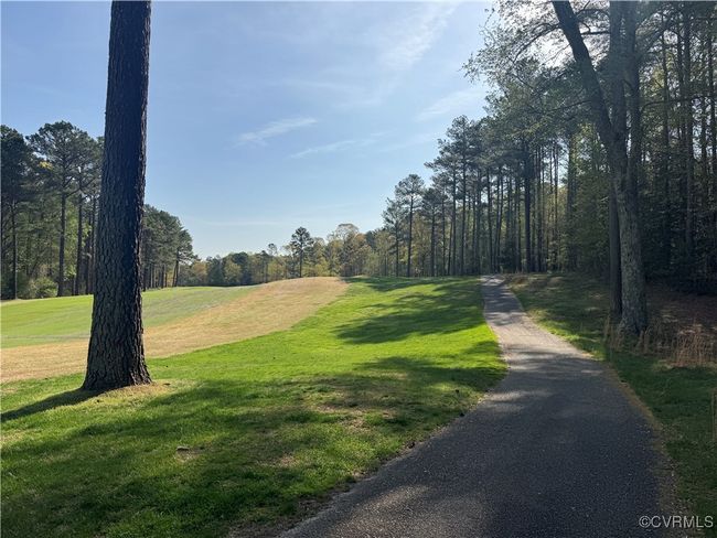 View is from the lot backing up to the golf course. Cart path is shown here. | Image 4