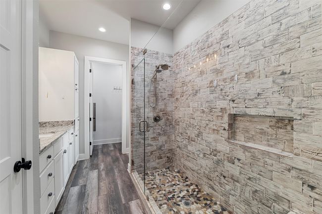 Bathroom featuring vanity, wood finished floors, recessed lighting, and a shower stall | Image 29