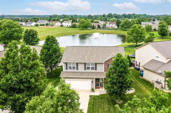 aerial perspective of suburban area featuring a large body of water | Image 31