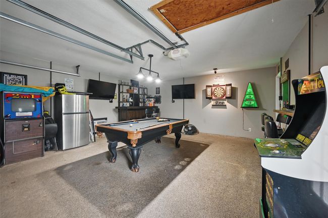 Rec room with billiards and a garage | Image 28