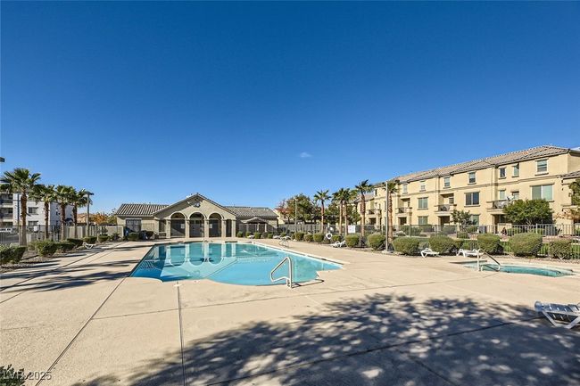 Pool featuring a patio area, a residential view, and fence | Image 15