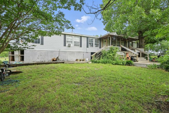View of front of property with stairway and a front lawn | Image 18