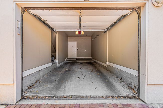 Garage featuring a garage door opener | Image 28