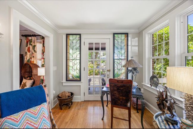 Living area featuring hardwood / wood-style floors and crown molding | Image 30