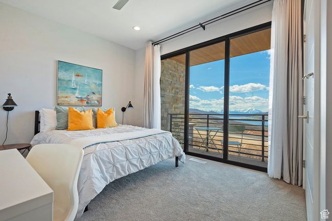 Bedroom with recessed lighting, access to exterior, carpet flooring, and visible vents | Image 17