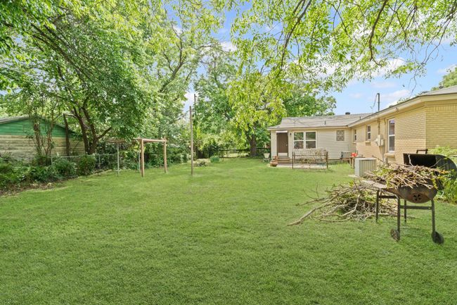 View of fenced backyard | Image 33