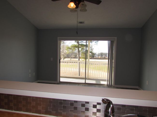 View from kitchen towards the living room. | Image 27