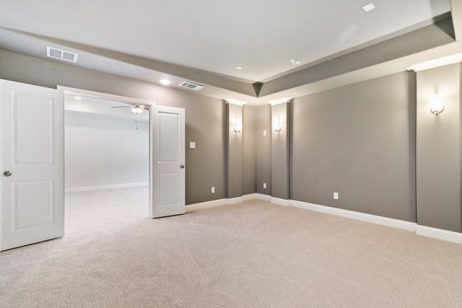 Empty room featuring baseboards, visible vents, and light colored carpet | Image 25