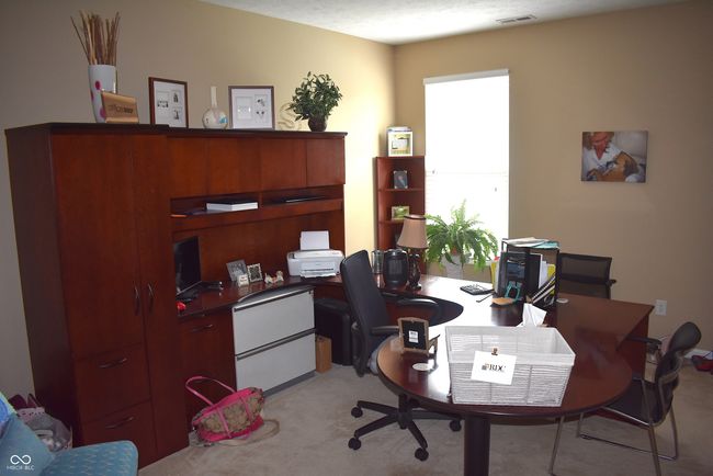 Bedroom on main level currently used as an office. | Image 13