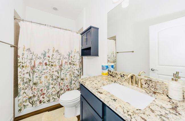 Full bath with toilet, vanity, and shower / bathtub combination | Image 4