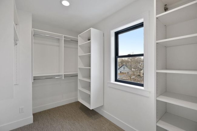 Walk-in closet with custom shelving. Pictures of previously built house. | Image 20