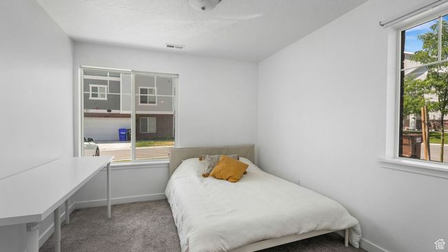 Carpeted bedroom featuring baseboards | Image 7